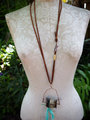 Concrete vertebrae necklace with found objects