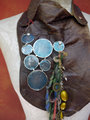 Gathered brown leather fringe bib necklace with blue capiz shell
