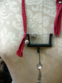 Recycled sewing machine part with hanging charm necklace