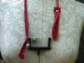 Recycled sewing machine part with hanging charm necklace
