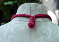 Recycled sewing machine part with hanging charm necklace