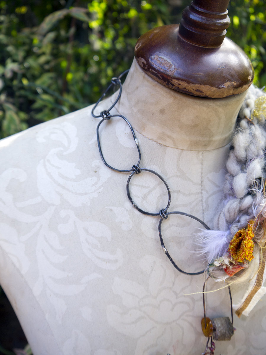 Abstract yarn necklace with steel links and organic embellishments