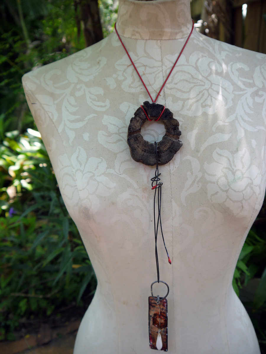 Concrete choya disc with dangling enamel charm