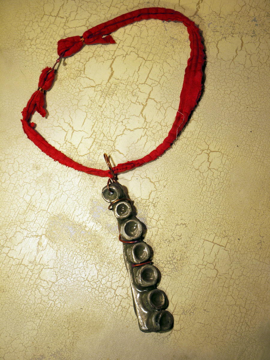 Concrete octopus necklace with recycled red cord