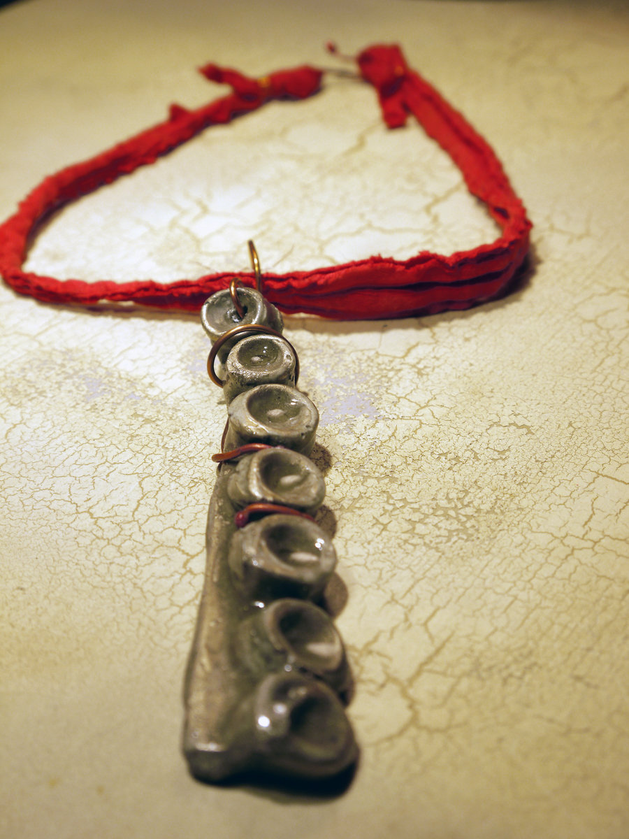 Concrete octopus necklace with recycled red cord