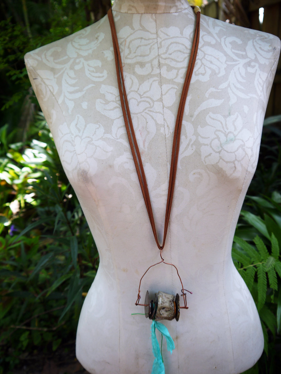 Concrete vertebrae necklace with found objects