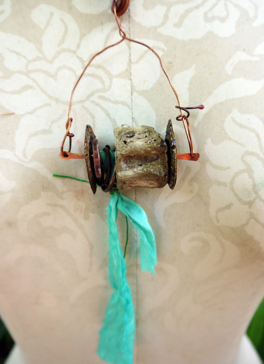 Concrete vertebrae necklace with found objects