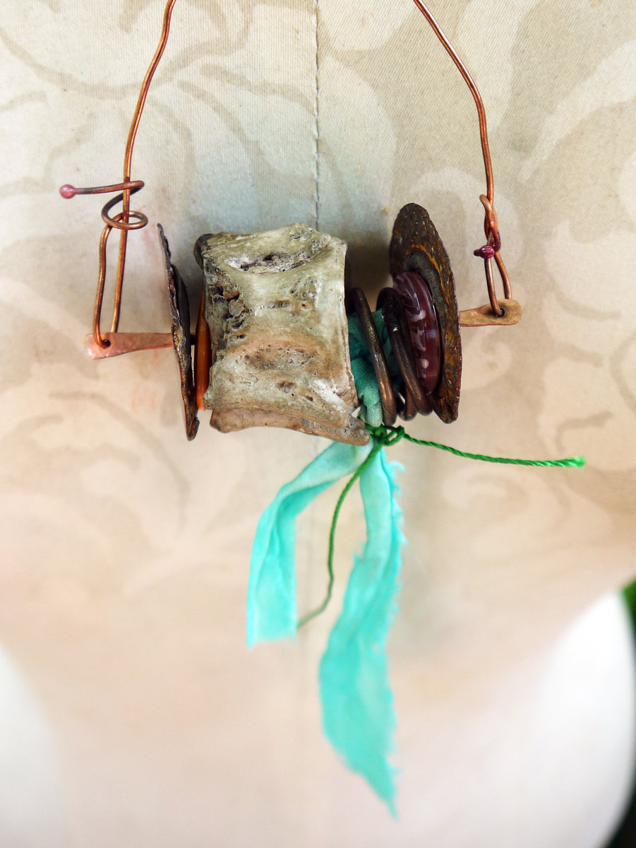 Concrete vertebrae necklace with found objects