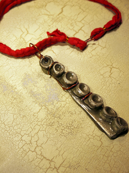 Concrete octopus necklace with recycled red cord