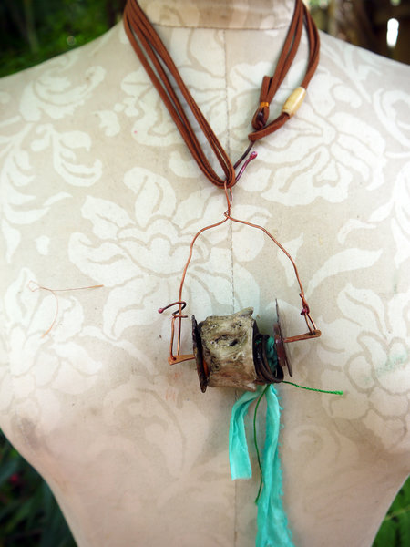 Concrete vertebrae necklace with found objects